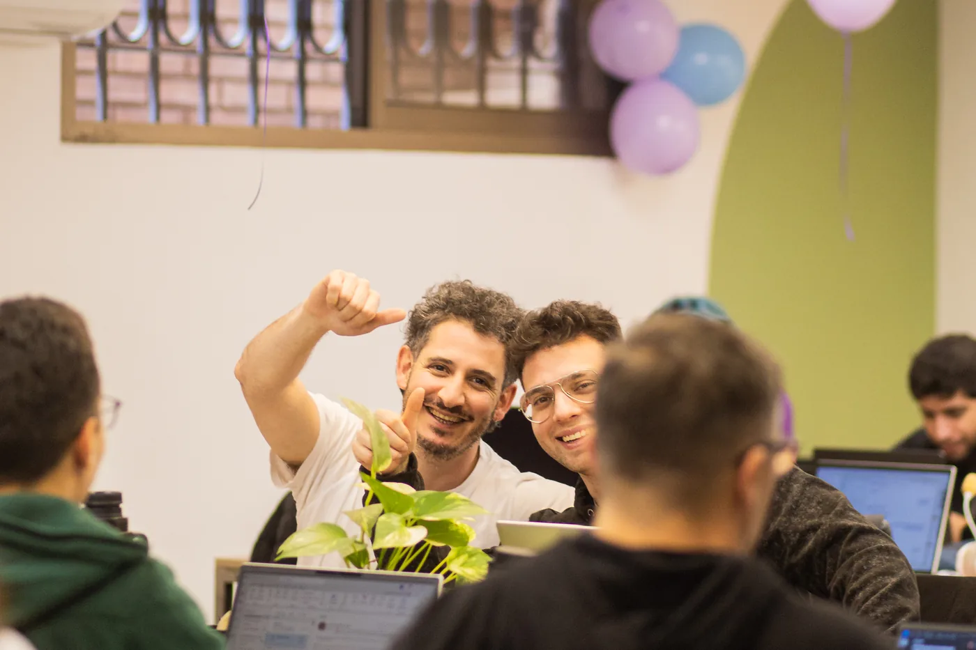 Team members sharing a spontaneous laugh at the office